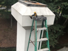 A chimney is serviced.