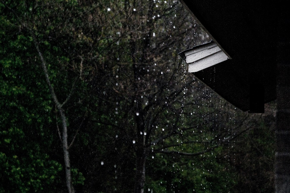 Rain dripping off of the roof.